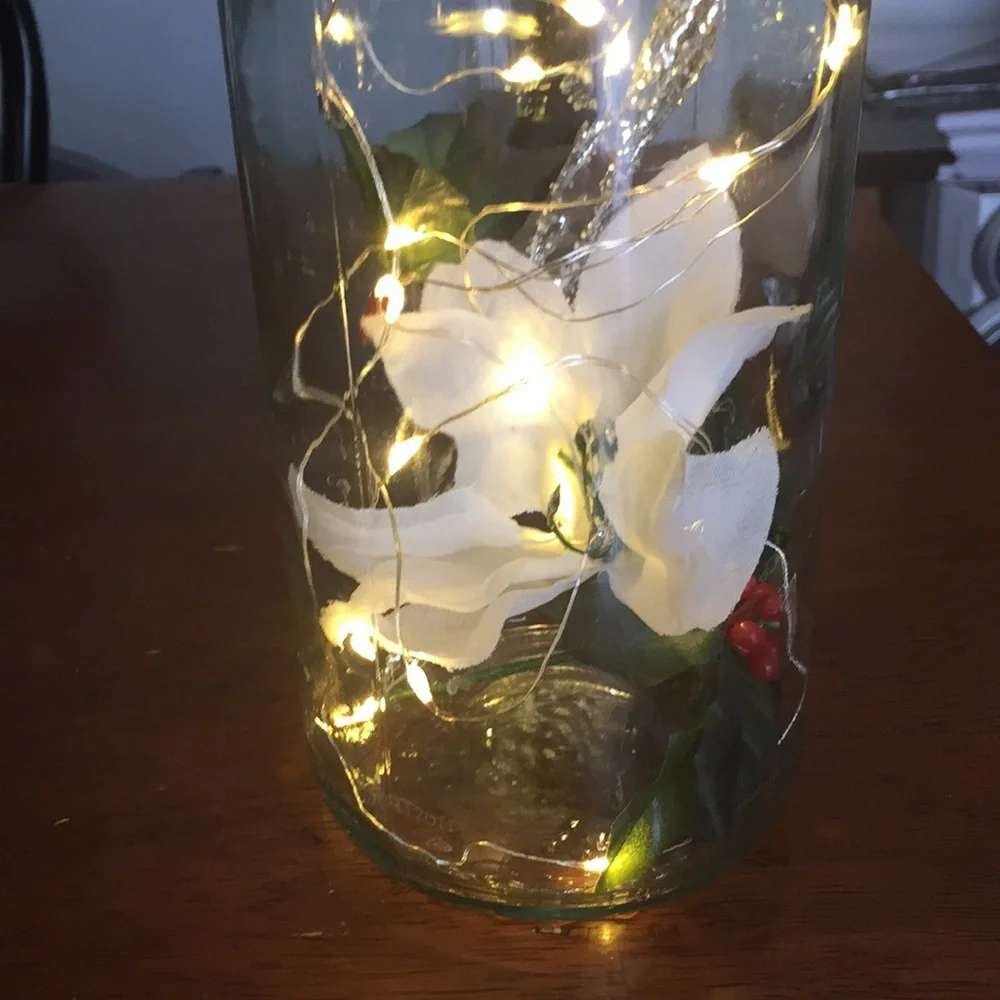 White poinsettia wine bottle lantern